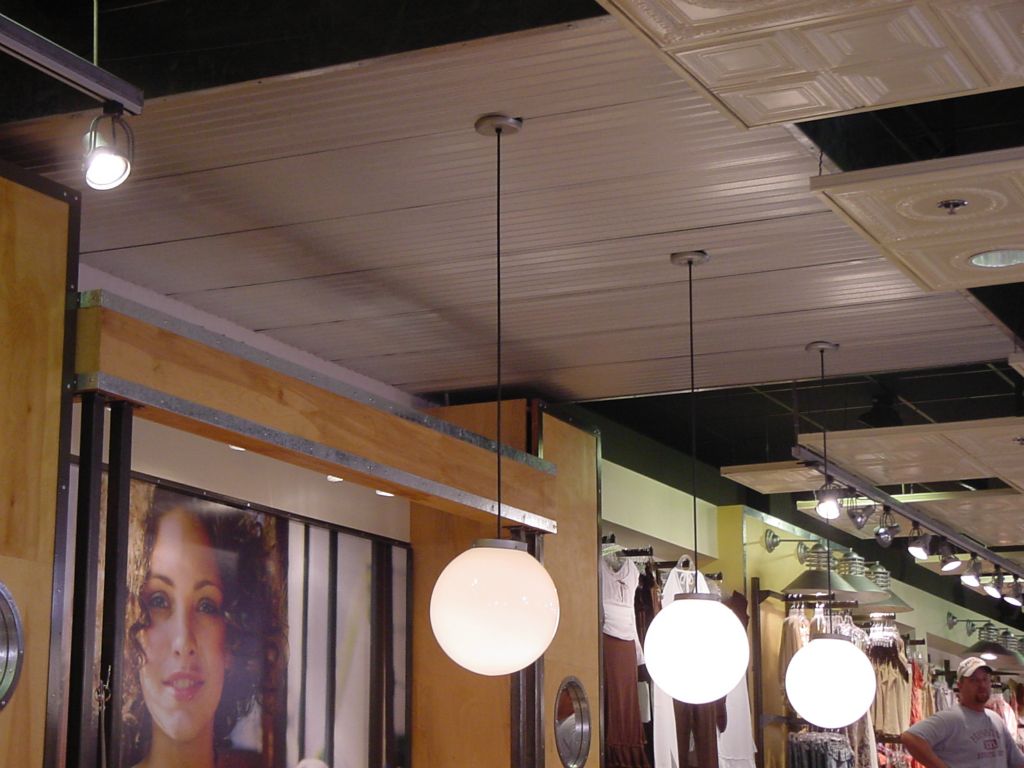 EXISTING CORRUGATED STEEL CEILING PANELS PRIOR TO INSTALLING TVs